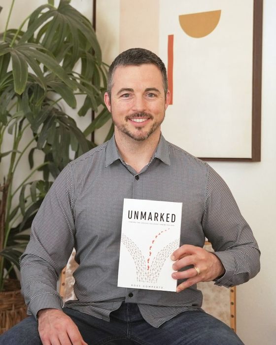 Ross Gompertz holding Unmarked
